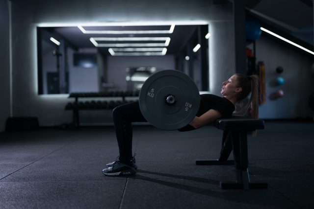 Workout takes place in a sleek, modern gym at night
