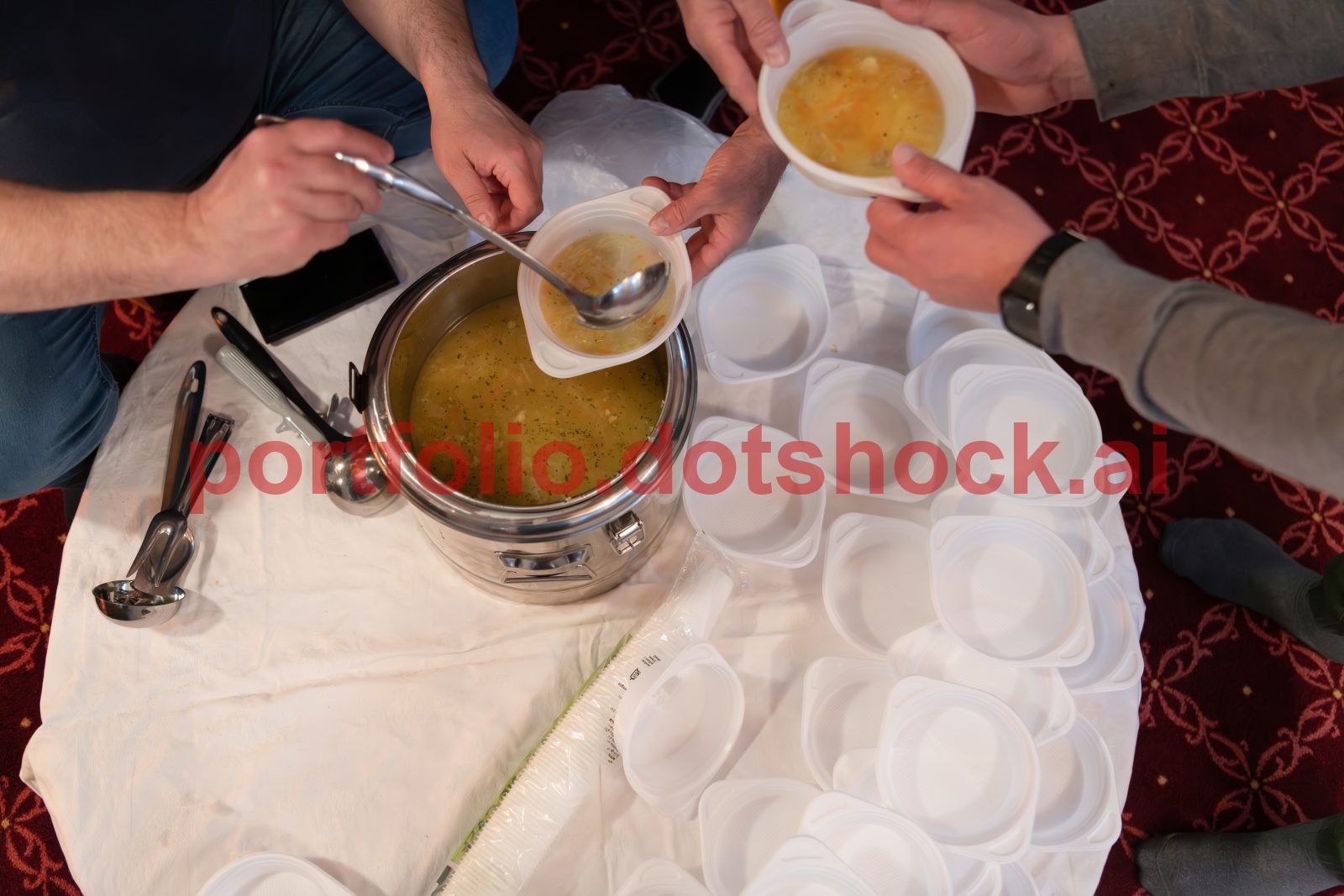 Top view of people serving food at a Mosque a communal meal during Ramadan before breaking the fast on Iftar dinner (7 of 28)