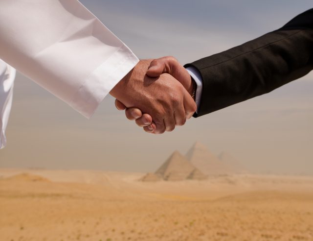 mp71511570-cross-cultural-business-handshake-between-an-arab-man-in.jpg