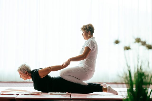 mp69173827-professional-female-physiotherapist-supporting-an-older.jpg
