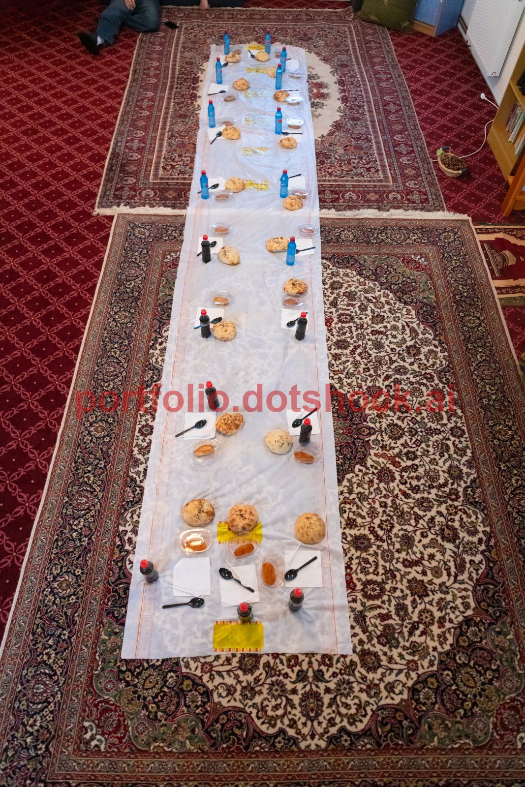 Top view of people serving food at a Mosque a communal meal during Ramadan before breaking the fast on Iftar dinner (2 of 28)
