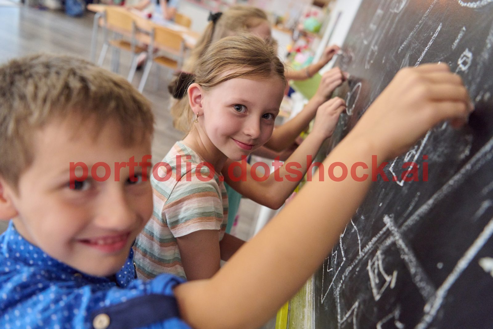 mp70321903-children-in-a-classroom-writing-on-a-chalkboard-and.jpg