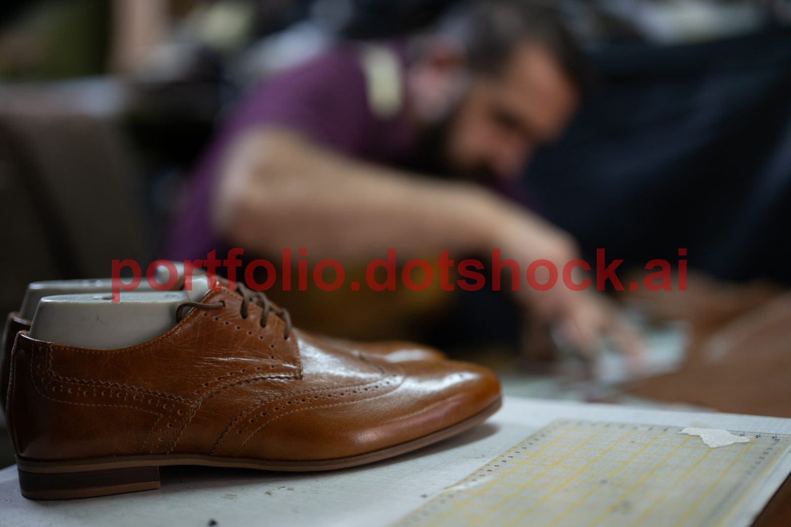 mp69500878-brown-leather-dress-shoe-on-a-workbench-with-a-cobbler-at.jpg